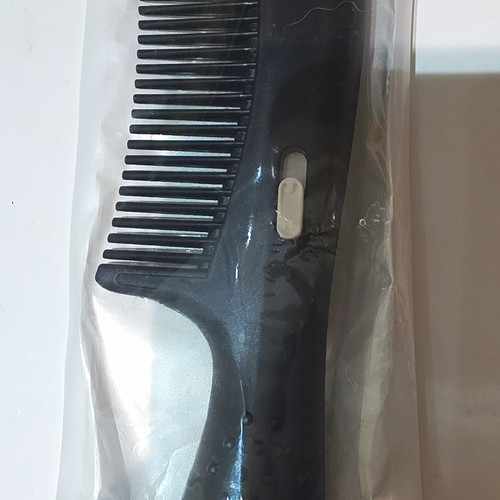 Black plastic detangling comb - detangling,